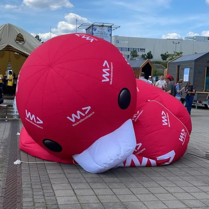 A big red deflated duck at the entrance of the congress